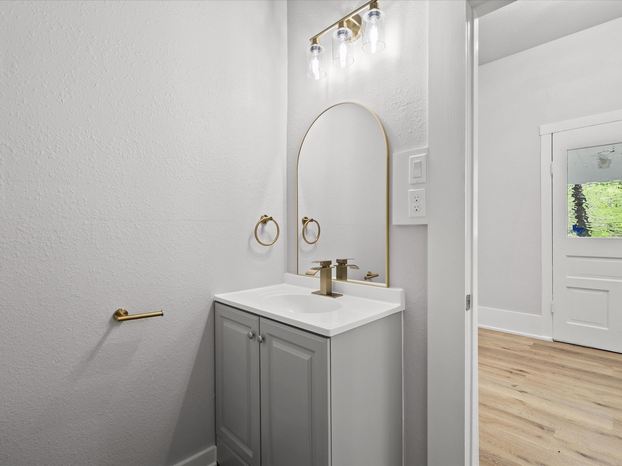 16958 Cedar Road Plantersville, TX 77363 - Photo 24 of 38 a bathroom with a sink and a mirror