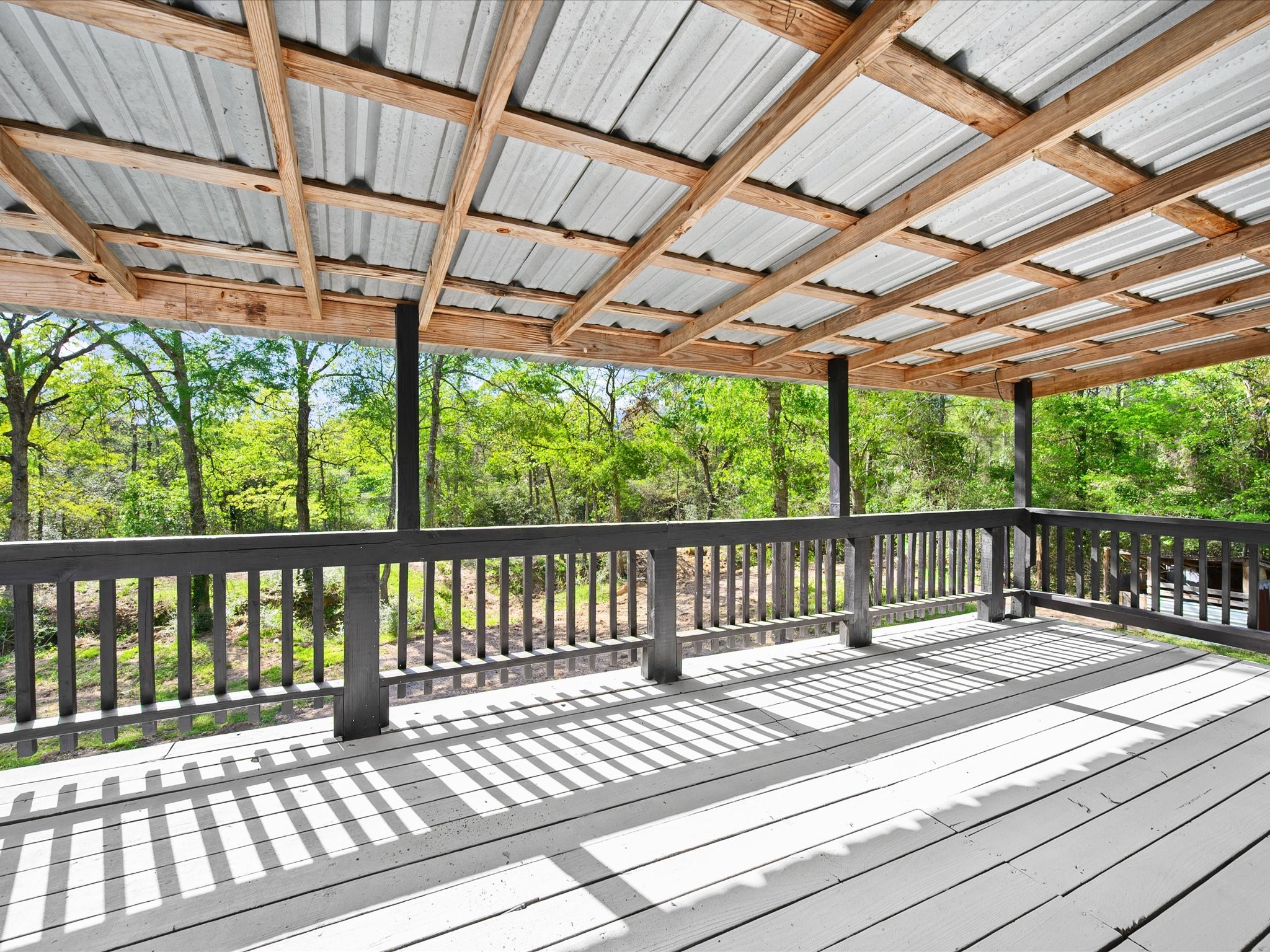 16958 Cedar Road Plantersville, TX 77363 - Photo 29 of 38 a view of porch with wooden floor