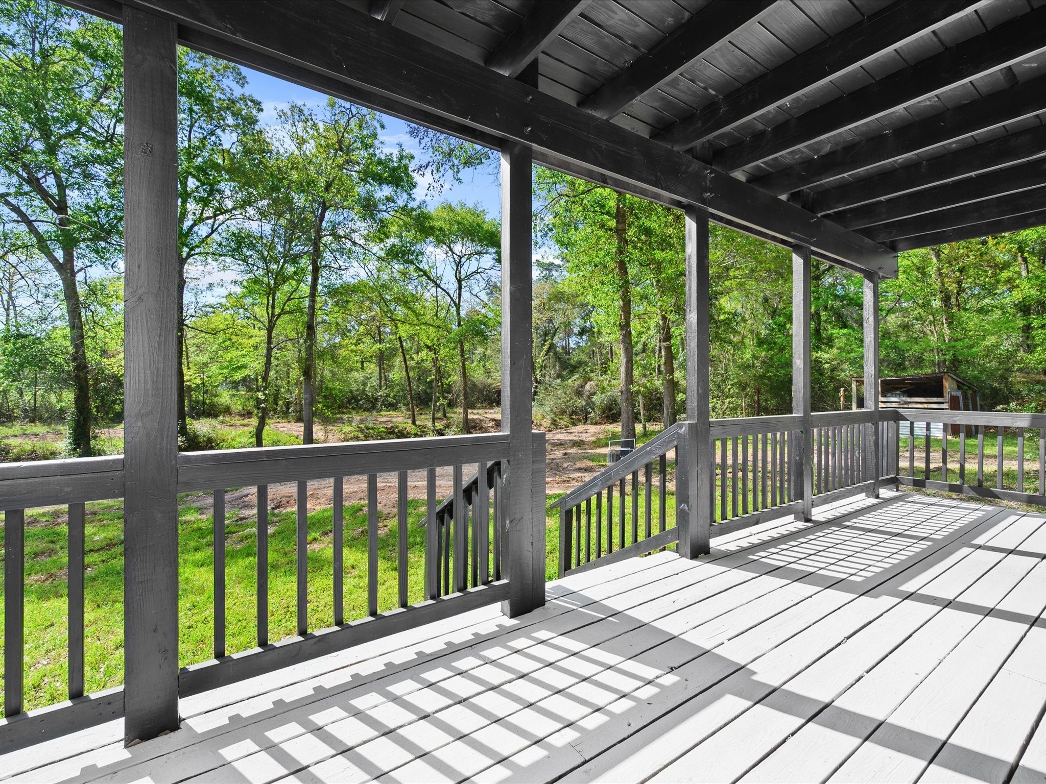 16958 Cedar Road Plantersville, TX 77363 - Photo 30 of 38 a view of a wooden deck
