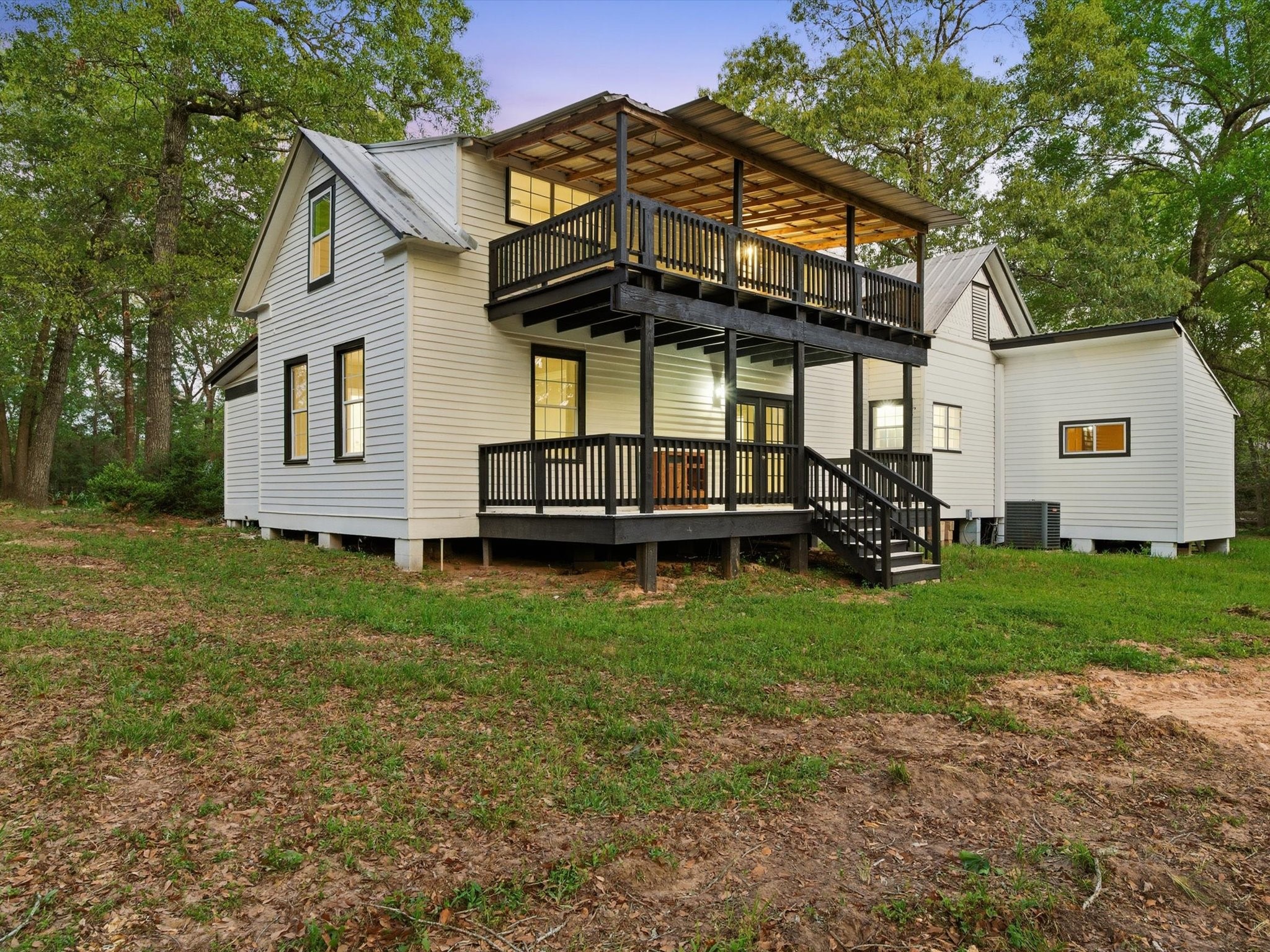 16958 Cedar Road Plantersville, TX 77363 - Photo 32 of 38 a view of a house with a big yard plants and large trees