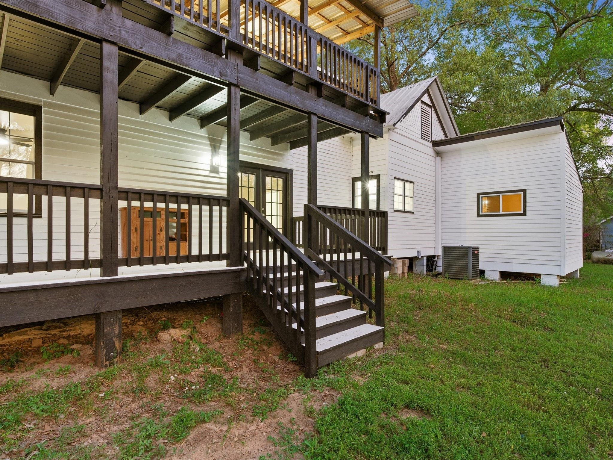 16958 Cedar Road Plantersville, TX 77363 - Photo 34 of 38 a view of a house with backyard and deck