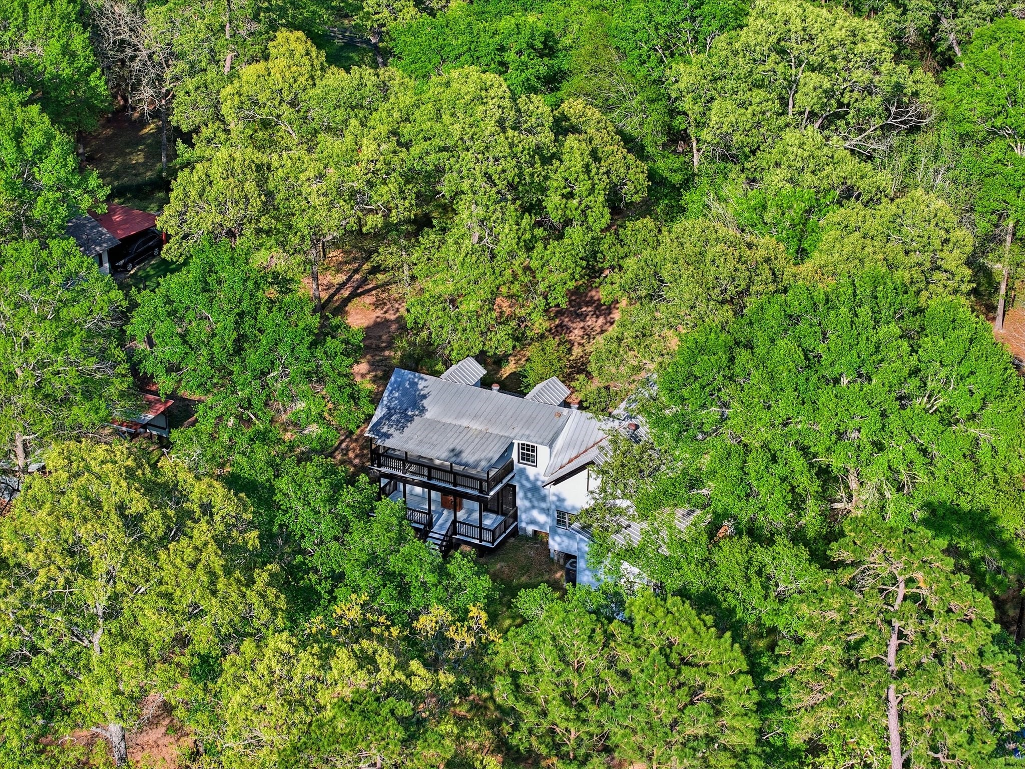 16958 Cedar Road Plantersville, TX 77363 - Photo 37 of 38 an aerial view of a house with a yard