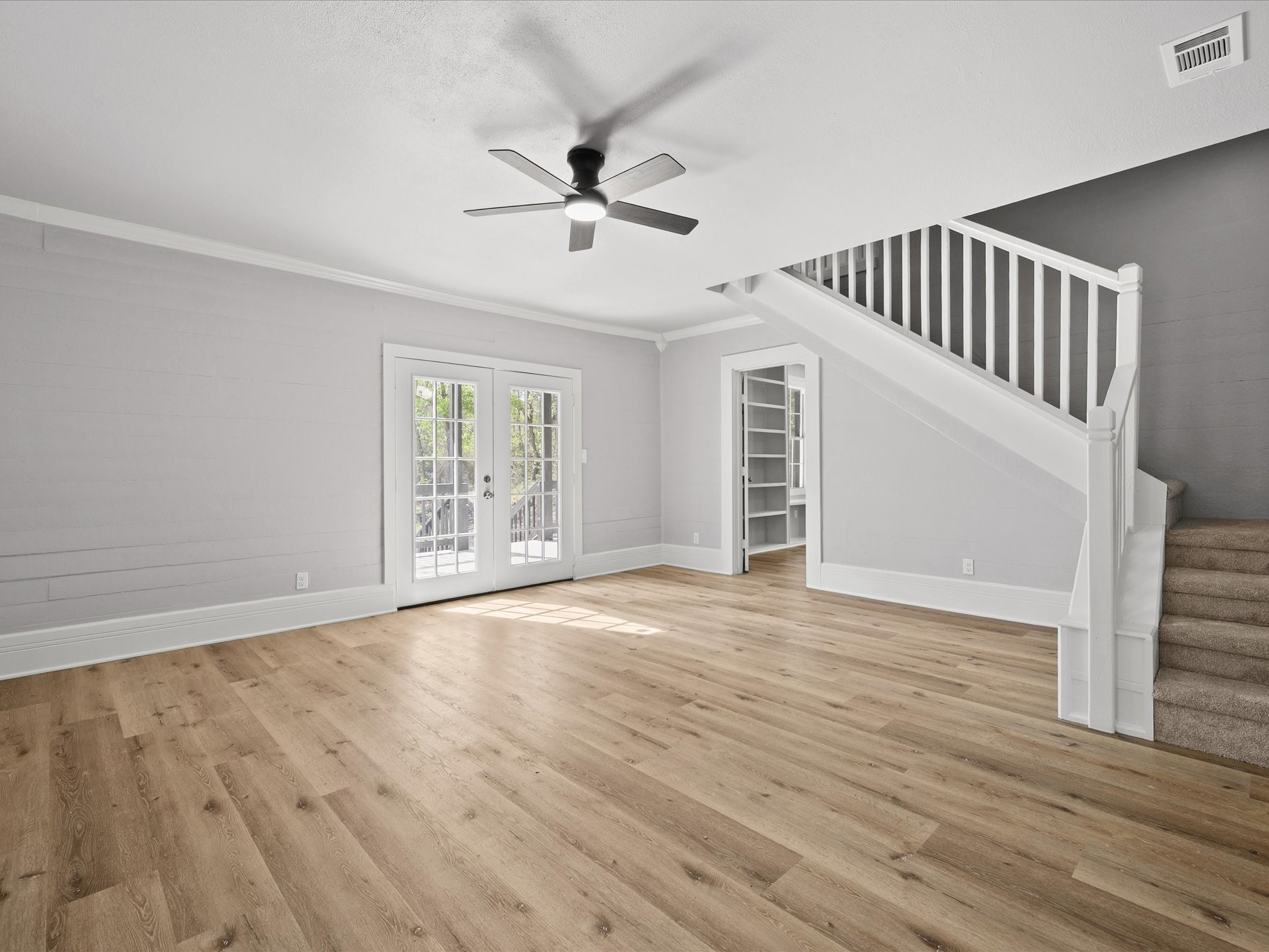 16958 Cedar Road Plantersville, TX 77363 - Photo 8 of 38 a view of an empty room with wooden floor and a window
