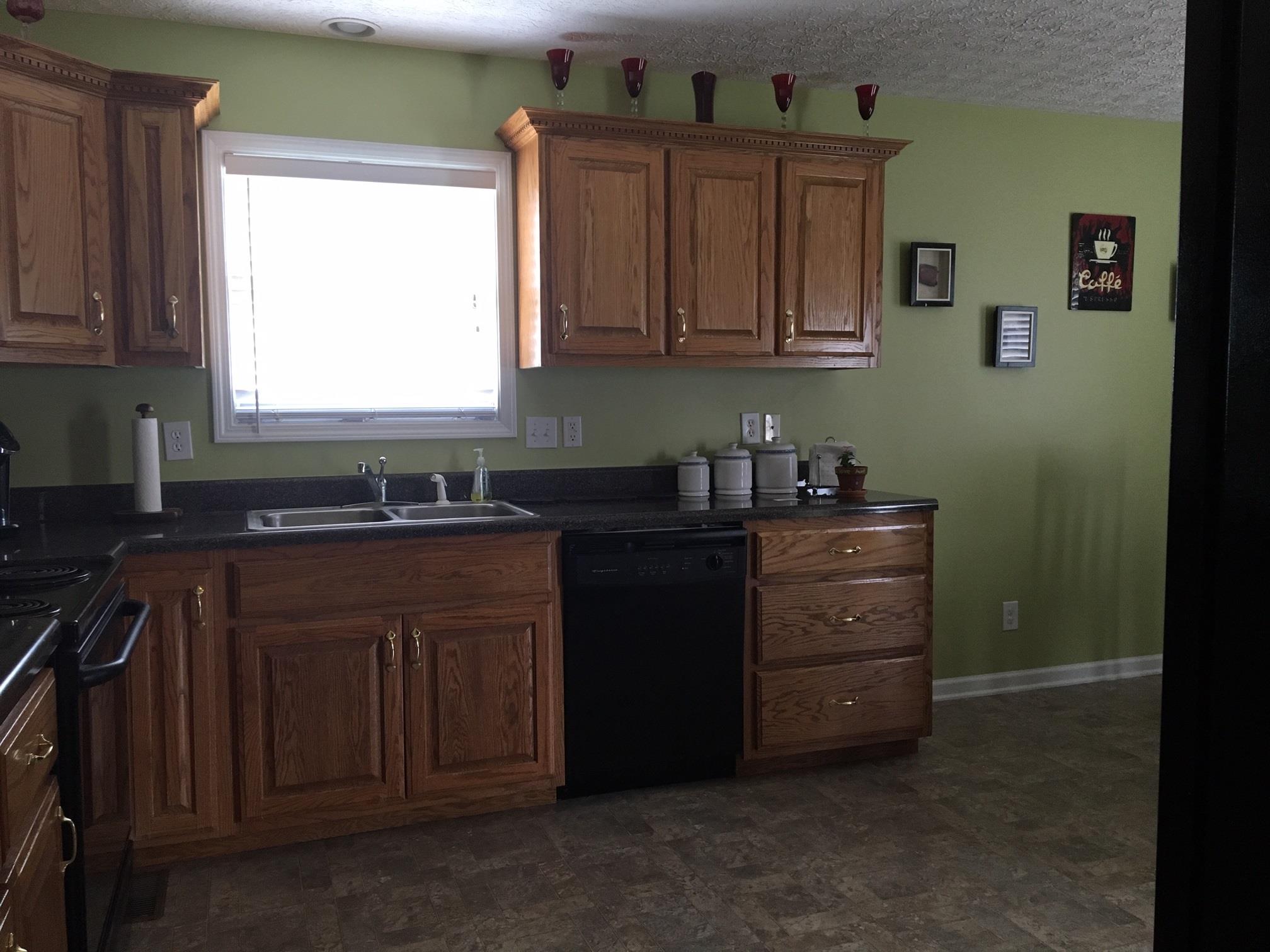 157 Brandywine Lane Springfield, TN 37172 - Photo 8 of 18 a kitchen with stainless steel appliances granite countertop a sink stove and cabinets