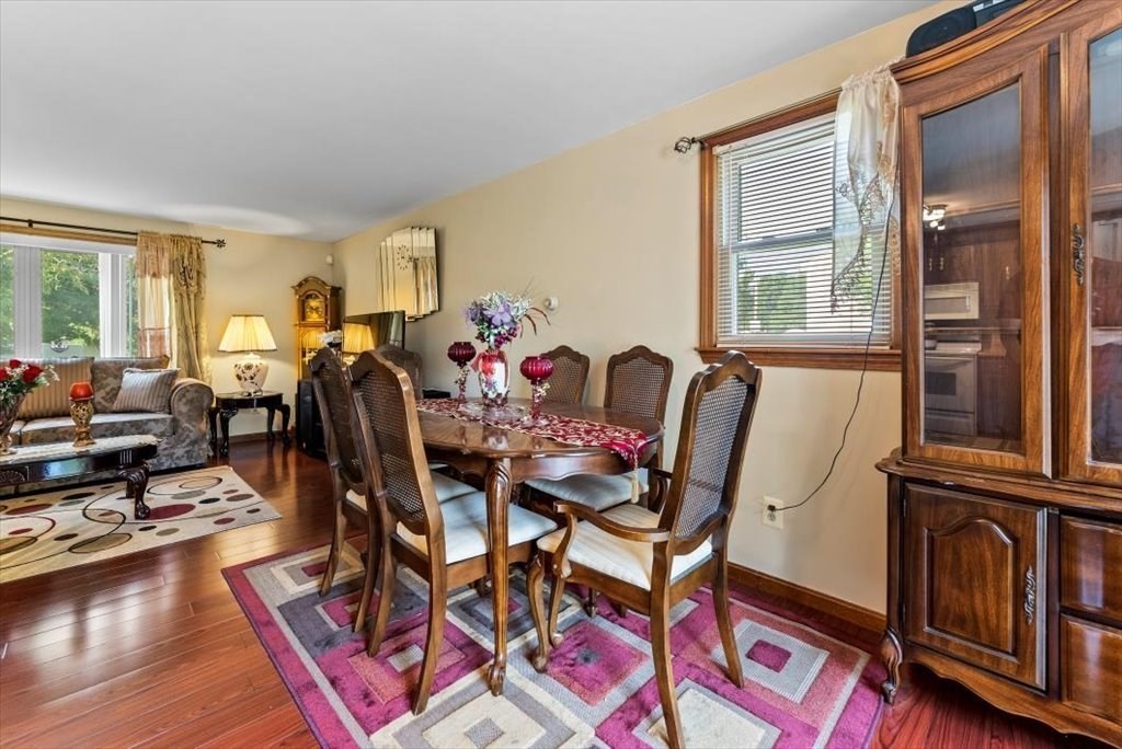 239 Ellendale Circle Springfield, MA 01128 - Photo 13 of 42 a view of a dining room with furniture window and wooden floor