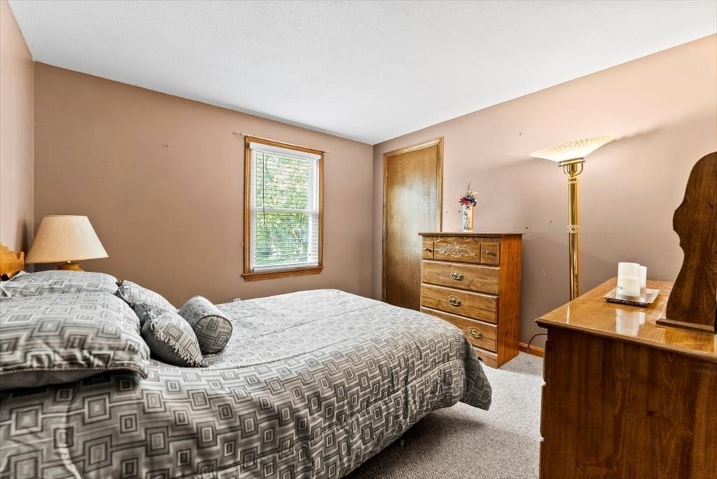239 Ellendale Circle Springfield, MA 01128 - Photo 19 of 42 a bedroom with a bed and a dresser