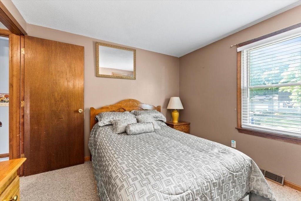 239 Ellendale Circle Springfield, MA 01128 - Photo 21 of 42 a bedroom with a bed and a window