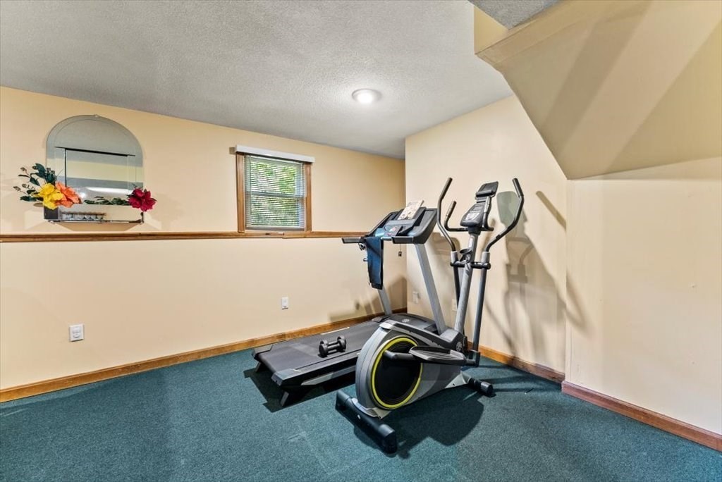 239 Ellendale Circle Springfield, MA 01128 - Photo 28 of 42 a room with gym equipment and view of living room
