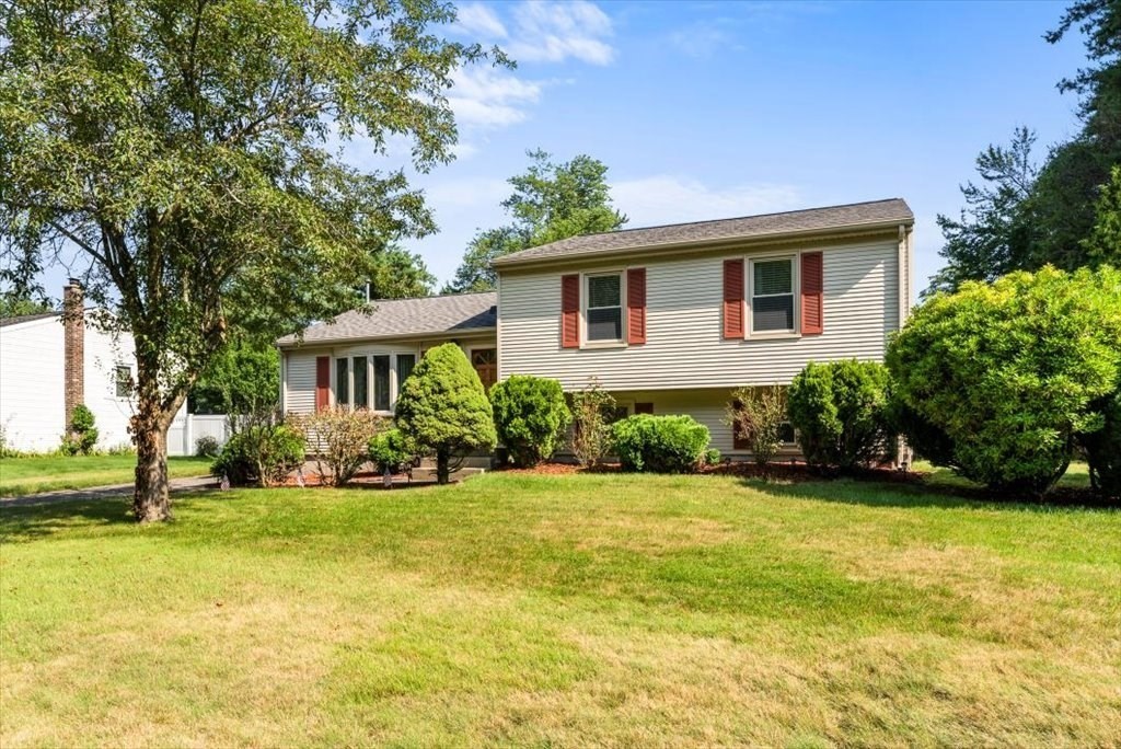 239 Ellendale Circle Springfield, MA 01128 - Photo 3 of 42 a front view of a house with a yard