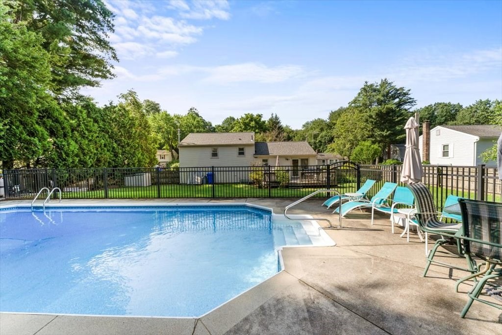 239 Ellendale Circle Springfield, MA 01128 - Photo 40 of 42 a view of a swimming pool with a lounge chair