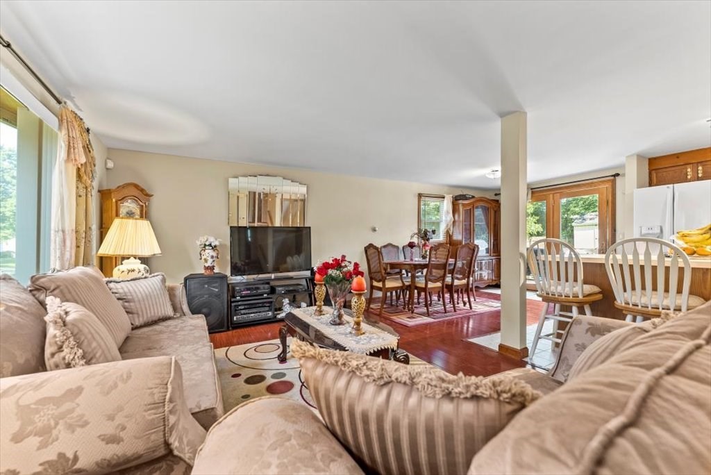 239 Ellendale Circle Springfield, MA 01128 - Photo 5 of 42 a living room with furniture and a flat screen tv