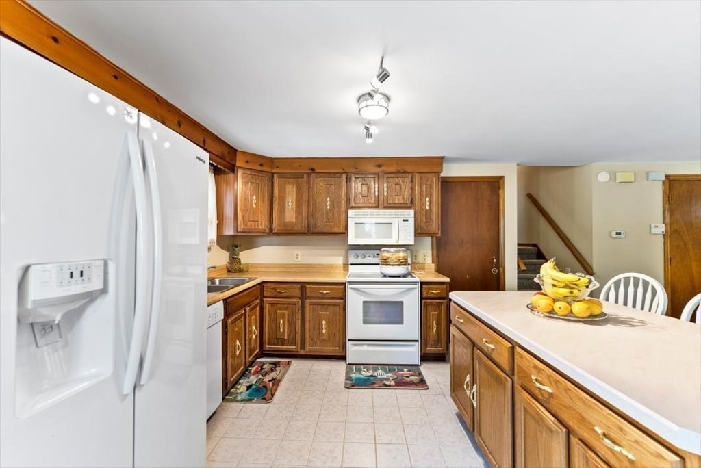 239 Ellendale Circle Springfield, MA 01128 - Photo 10 of 42 a kitchen with a sink appliances and cabinets