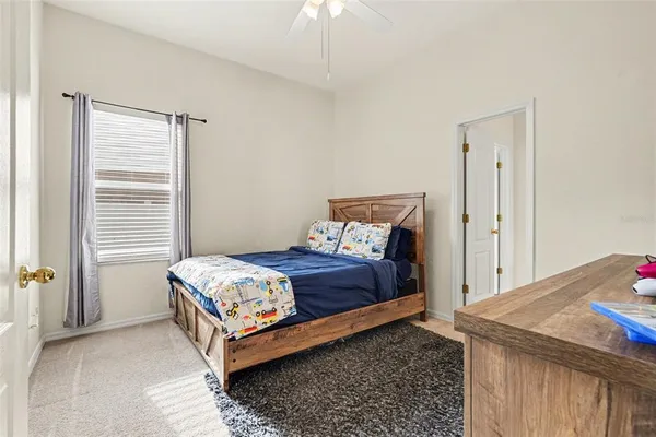 a bedroom with a bed and a table