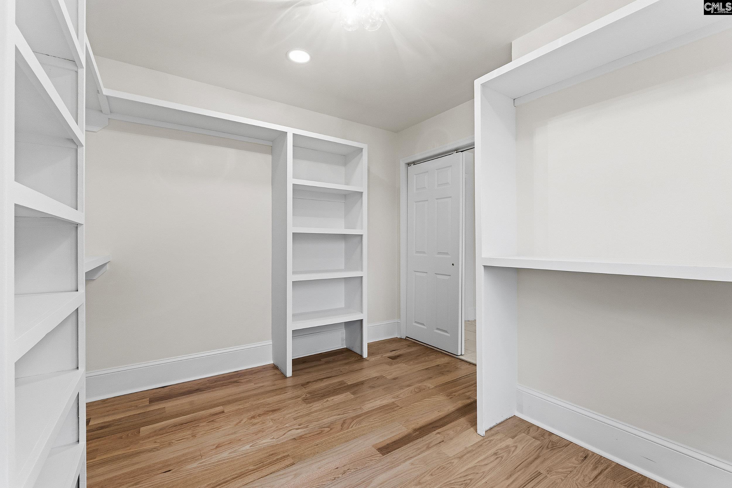 121 Silver Lake Road East Columbia, SC 29223 - Photo 40 of 57 a view of walk in closet with empty racks