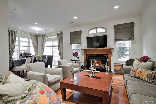 a living room with furniture fireplace and a flat screen tv