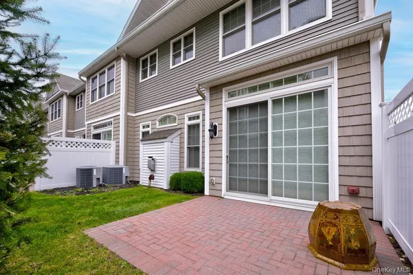 a view of a front of a house with a yard