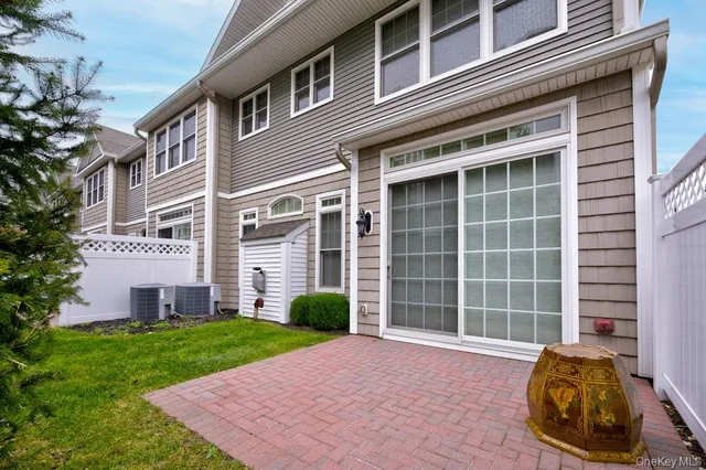 a view of a front of a house with a yard