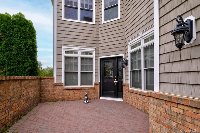 front view of a house with a large window
