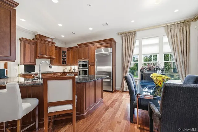 a kitchen with granite countertop lots of counter top space and stainless steel appliances