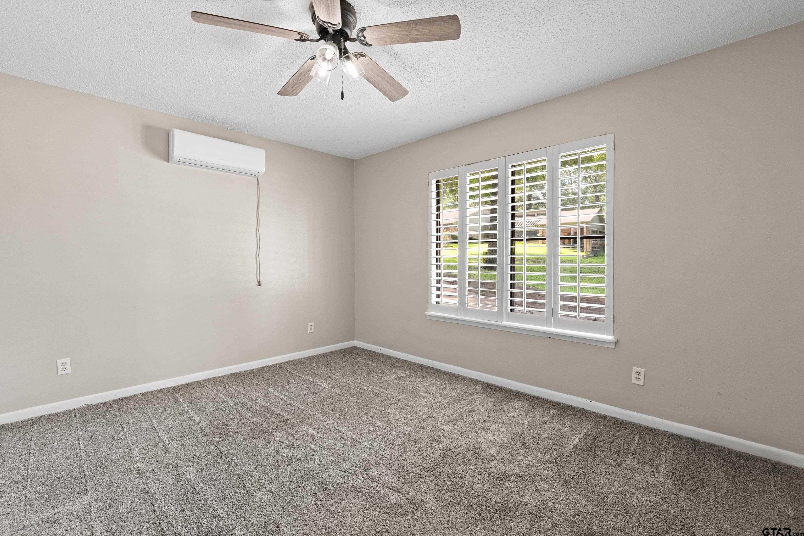1821 Azalea Street Gilmer, TX 75644 - Photo 23 of 34 a view of an empty room with a window