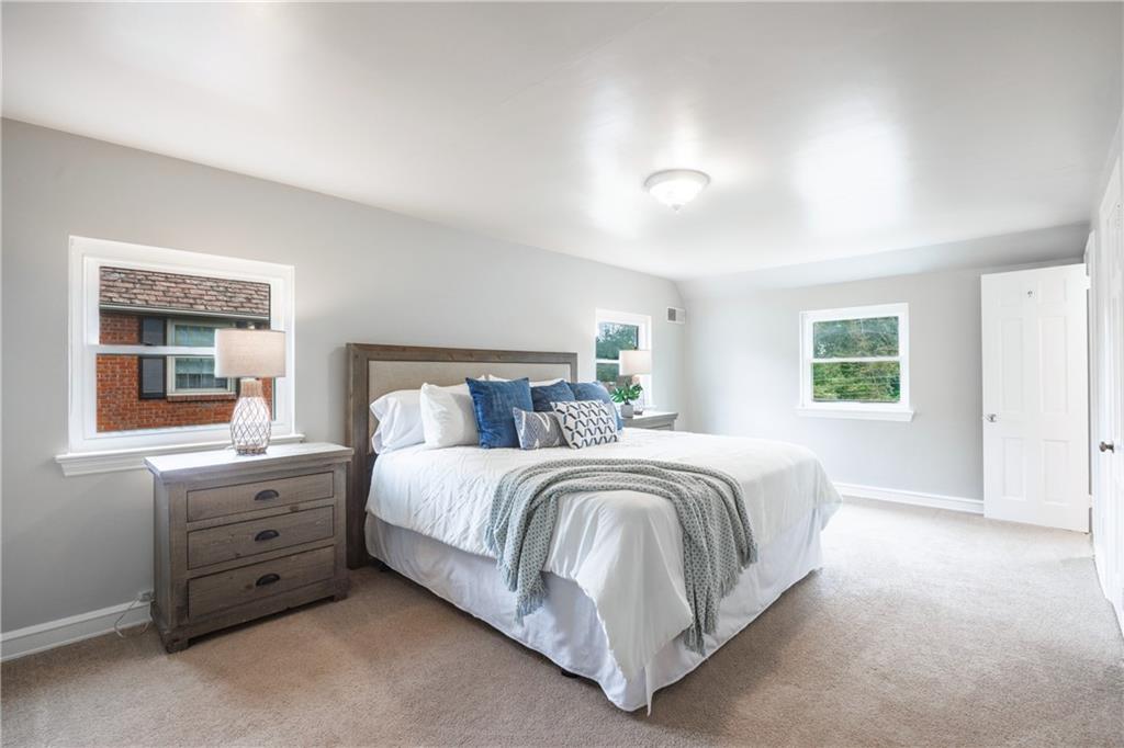 1025 Old Gate Road Pittsburgh, PA 15235 - Photo 13 of 27 a spacious bedroom with a bed and a window