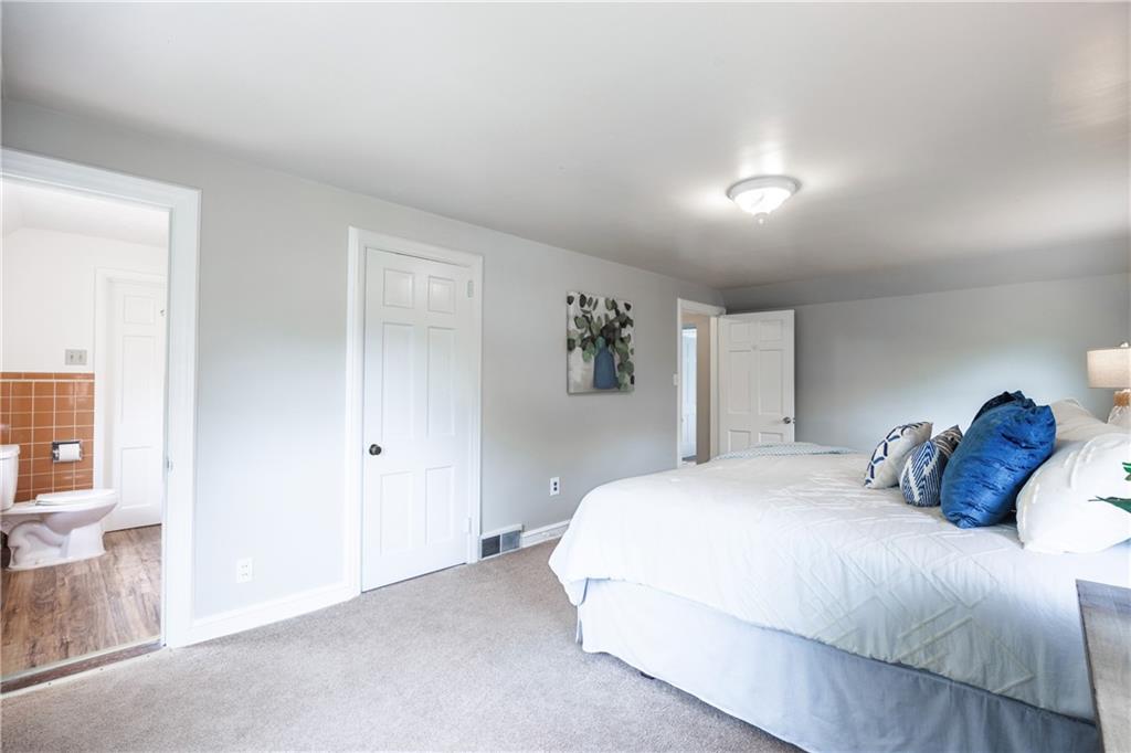 1025 Old Gate Road Pittsburgh, PA 15235 - Photo 14 of 27 a bedroom with a bed and a window