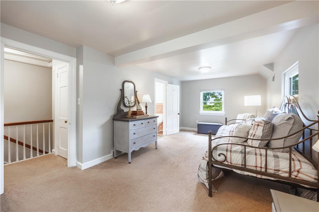 1025 Old Gate Road Pittsburgh, PA 15235 - Photo 17 of 27 a living room with furniture a window and gym equipment