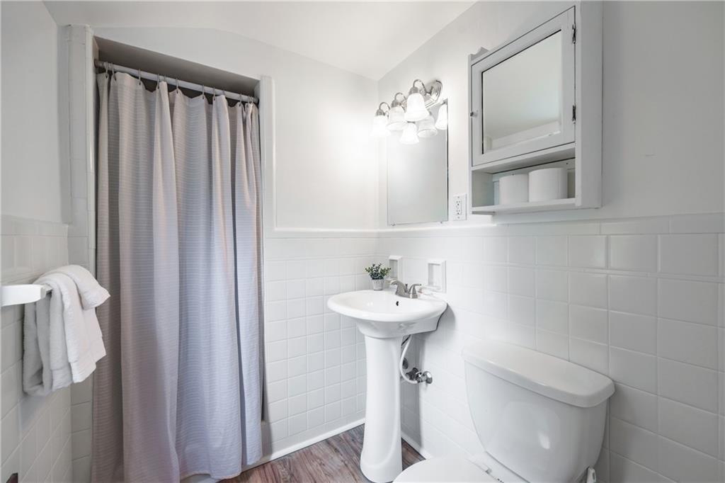 1025 Old Gate Road Pittsburgh, PA 15235 - Photo 19 of 27 a bathroom with a sink a toilet and shower