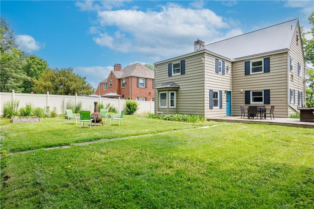 1025 Old Gate Road Pittsburgh, PA 15235 - Photo 21 of 27 a front view of a house with a yard and garage