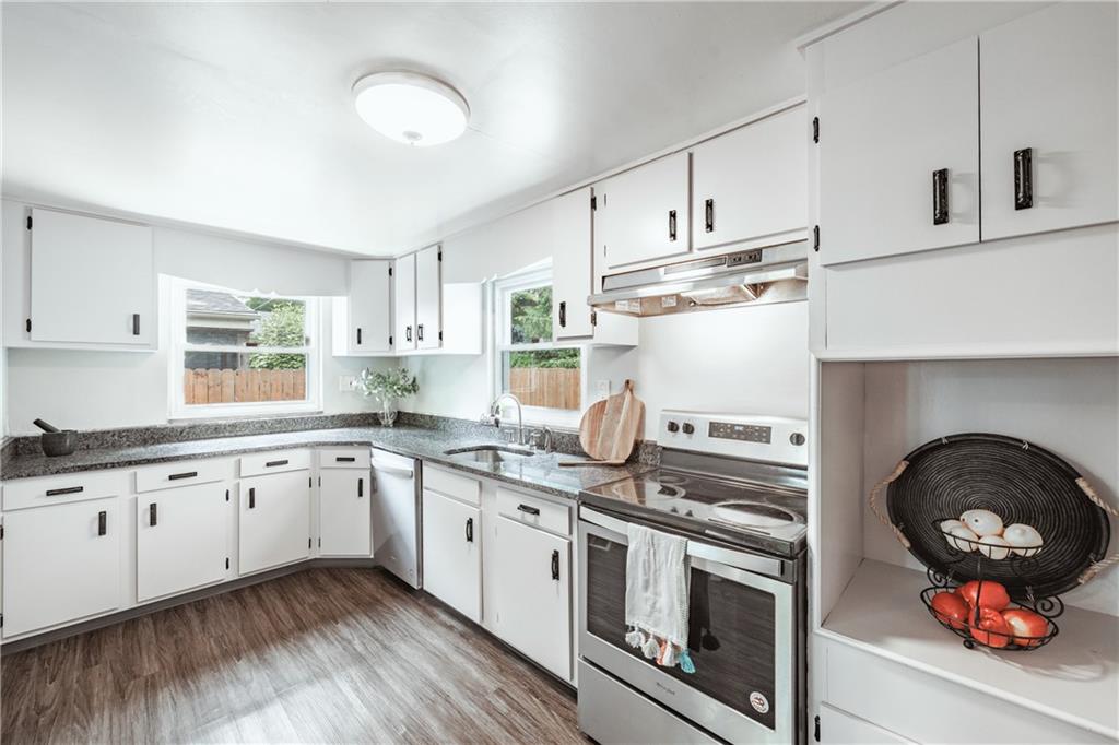 1025 Old Gate Road Pittsburgh, PA 15235 - Photo 7 of 27 a kitchen with granite countertop a stove a sink and a refrigerator