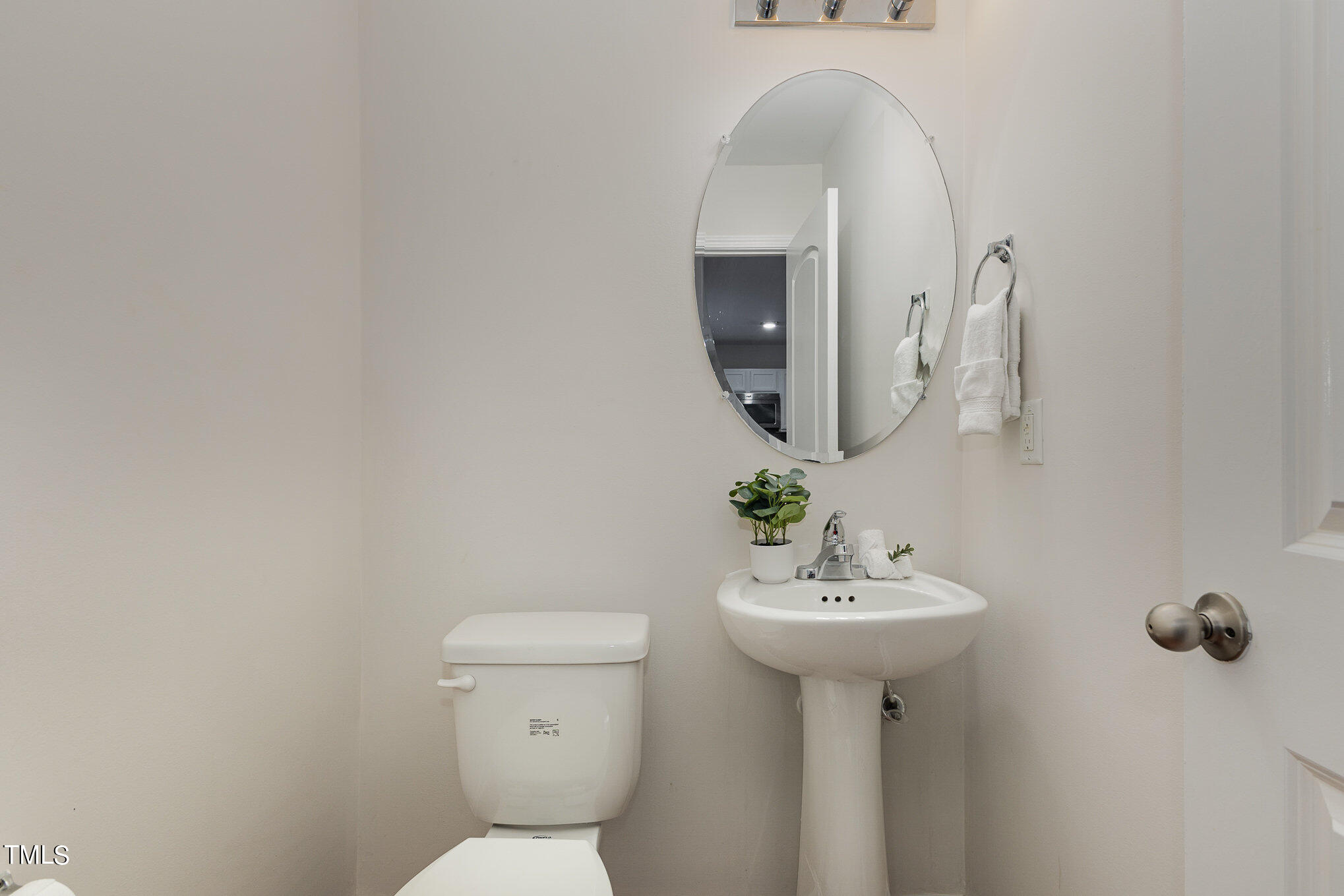 1608 Moineau Lane Raleigh, NC 27610 - Photo 7 of 15 a bathroom with a sink toilet and a mirror