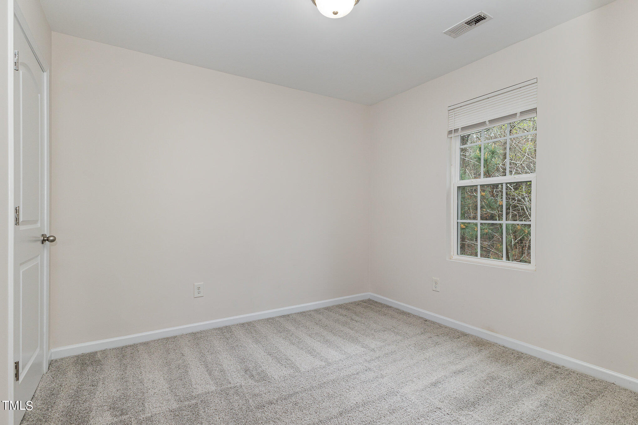 1608 Moineau Lane Raleigh, NC 27610 - Photo 9 of 15 an empty room with a window