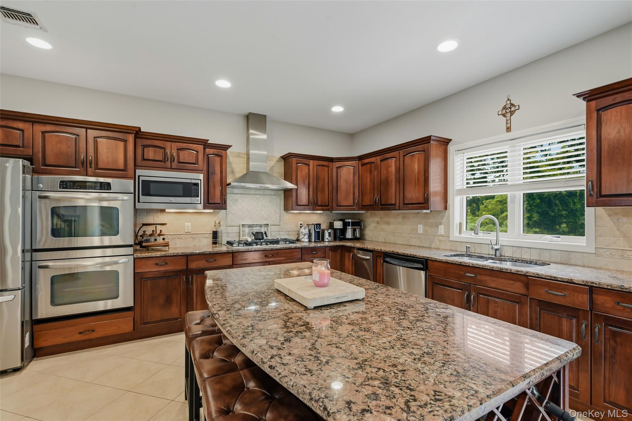 51 Meriwether Trail Congers, NY 10920 - Photo 13 of 50 Kitchen featuring a large island with granite countertops, wood cabinetry, stainless steel appliances, and recessed lighting