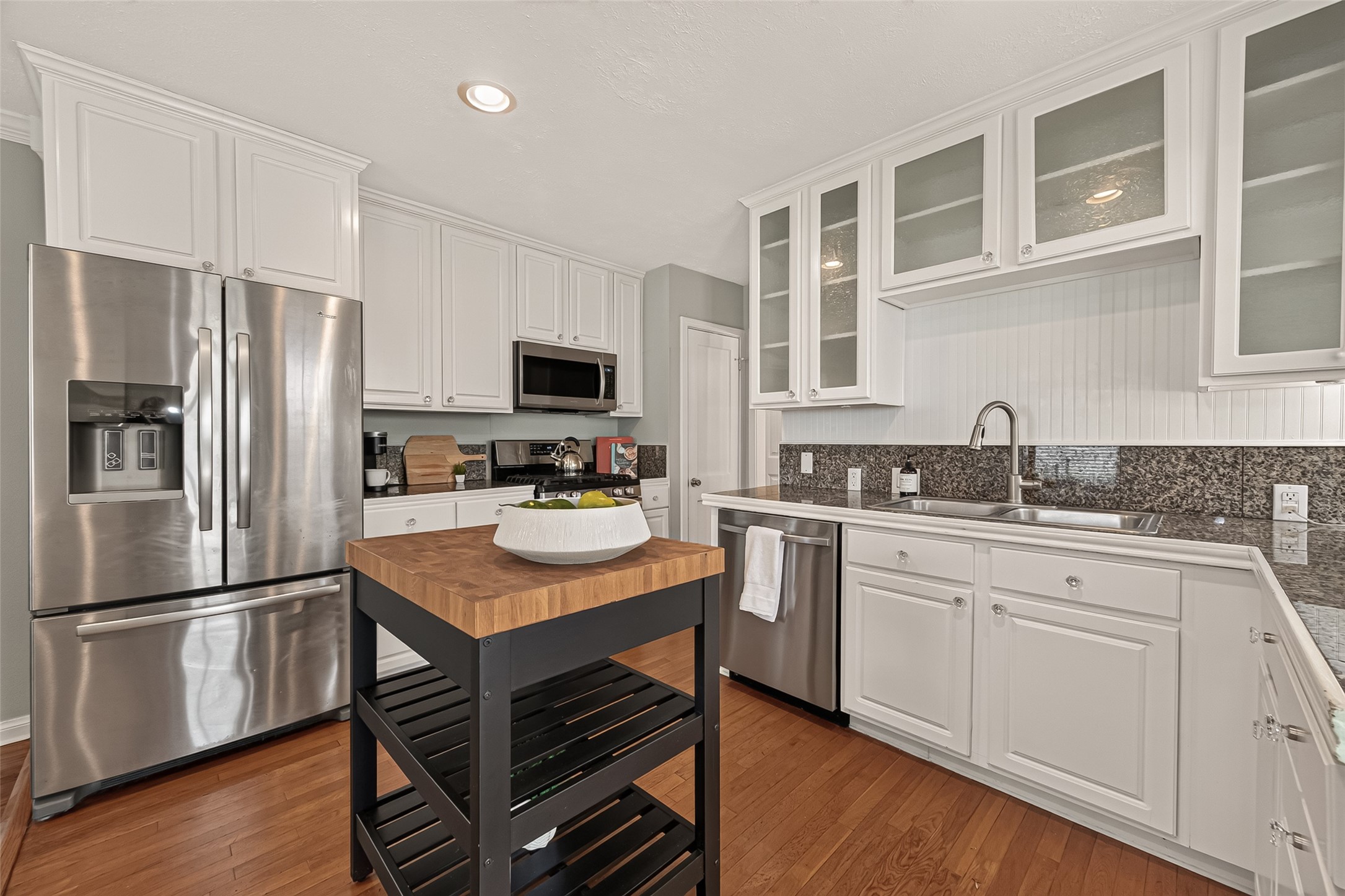 2019 Gostick Street Houston, TX 77008 - Photo 18 of 36 a kitchen with a refrigerator stove microwave and sink