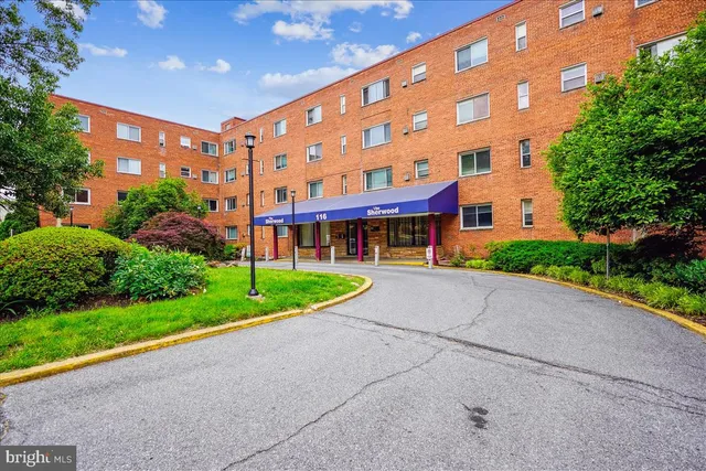 a view of a building with a yard