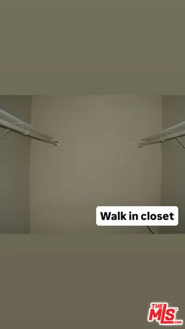 a view of water heater and racks