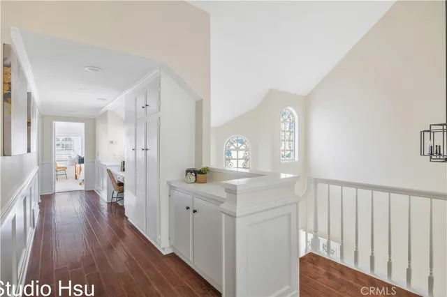 a view of hallway with wooden floor