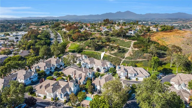 an aerial view of residential house with outdoor space and mountain view