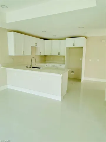 a view of a kitchen with a sink