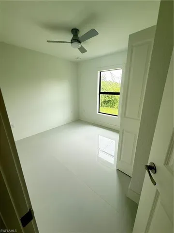 a view of empty room with windows