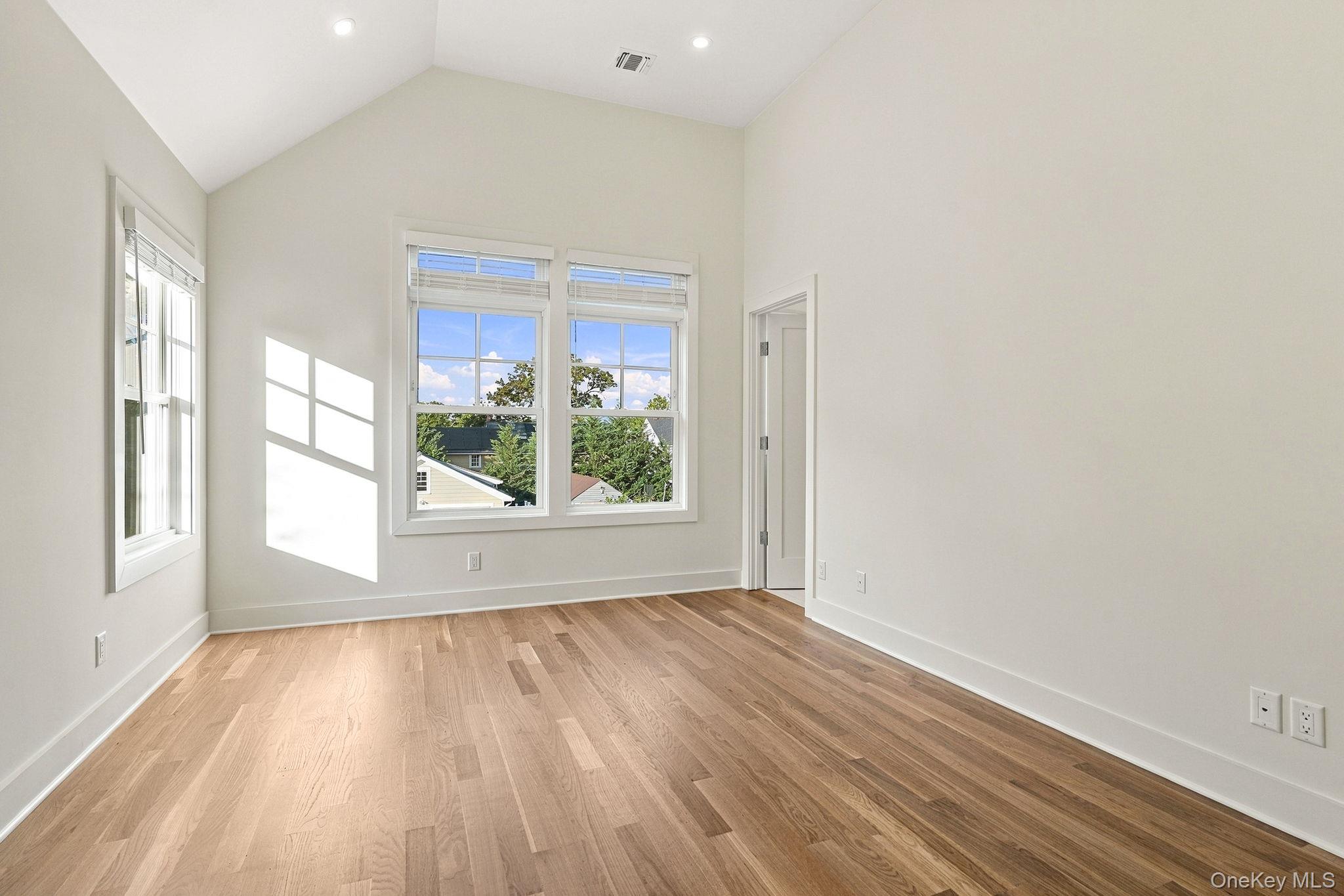 72 Orchard Avenue Rye, NY 10580 - Photo 25 of 40 primary bedroom with cathedral ceilings