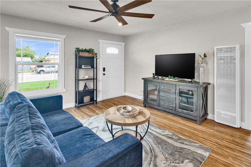 848 Mentone Avenue Grover Beach, CA 93433 - Photo 11 of 33 a living room with furniture and a flat screen tv