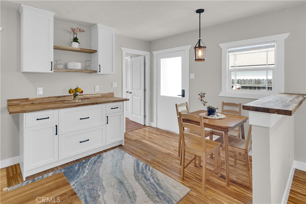 848 Mentone Avenue Grover Beach, CA 93433 - Photo 19 of 33 a kitchen with granite countertop a sink cabinets and window
