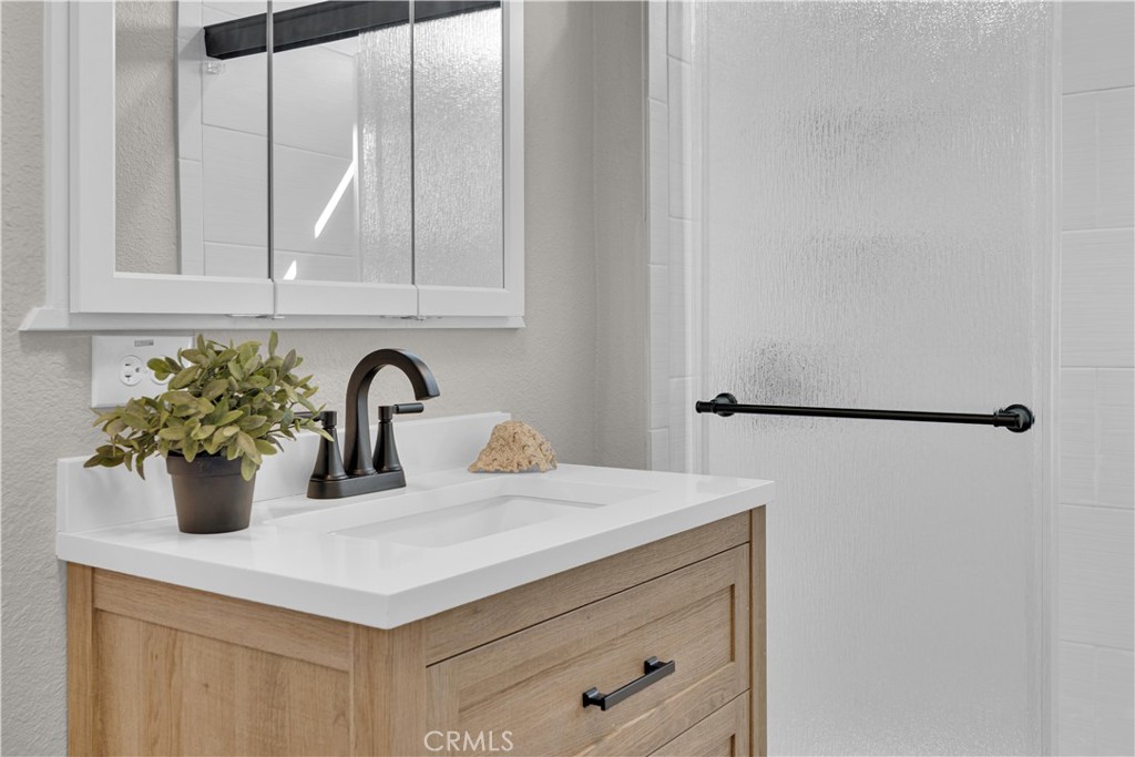 848 Mentone Avenue Grover Beach, CA 93433 - Photo 23 of 33 a kitchen with a sink and a potted plant