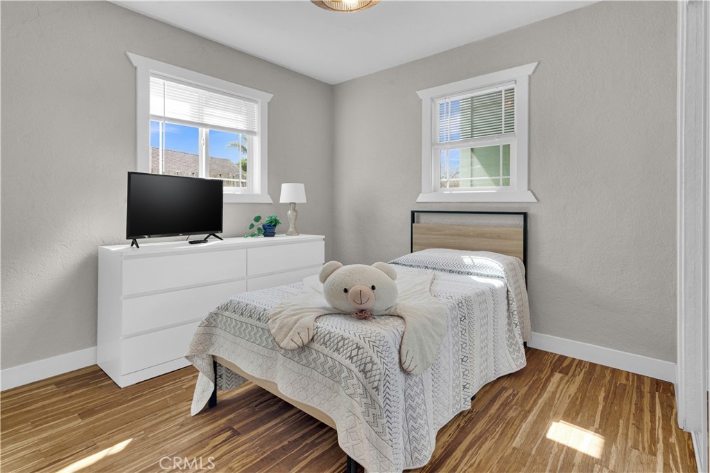 848 Mentone Avenue Grover Beach, CA 93433 - Photo 26 of 33 a bedroom with a bed and flat screen tv