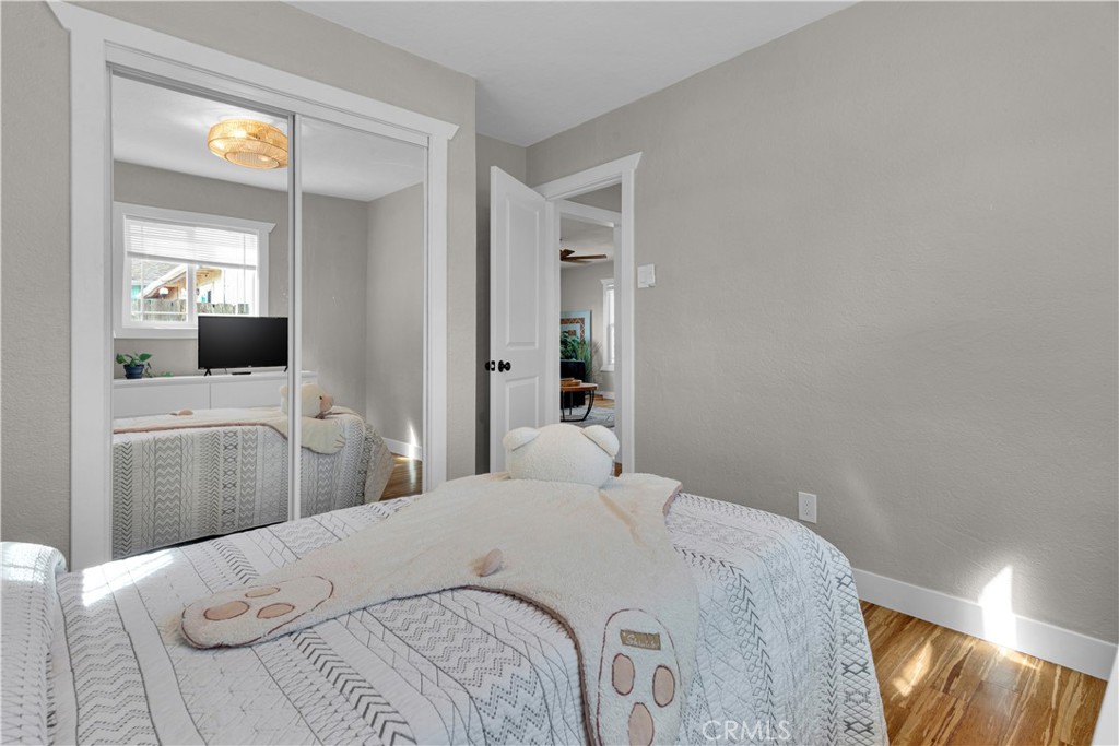 848 Mentone Avenue Grover Beach, CA 93433 - Photo 27 of 33 a bedroom with a bed and a large mirror