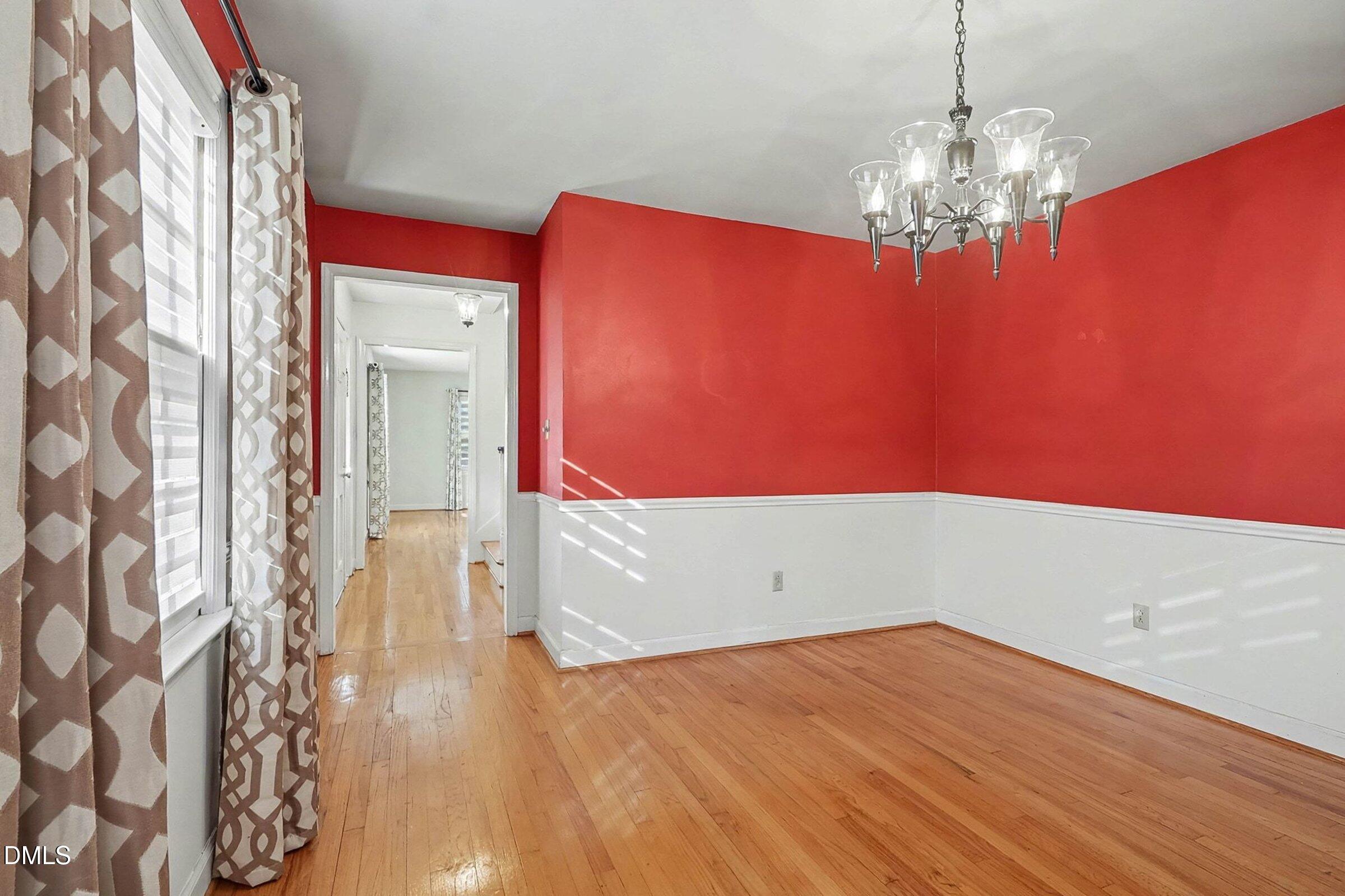 3704 Pembrook Place Raleigh, NC 27612 - Photo 13 of 68 a view of empty room with wooden floor and fan