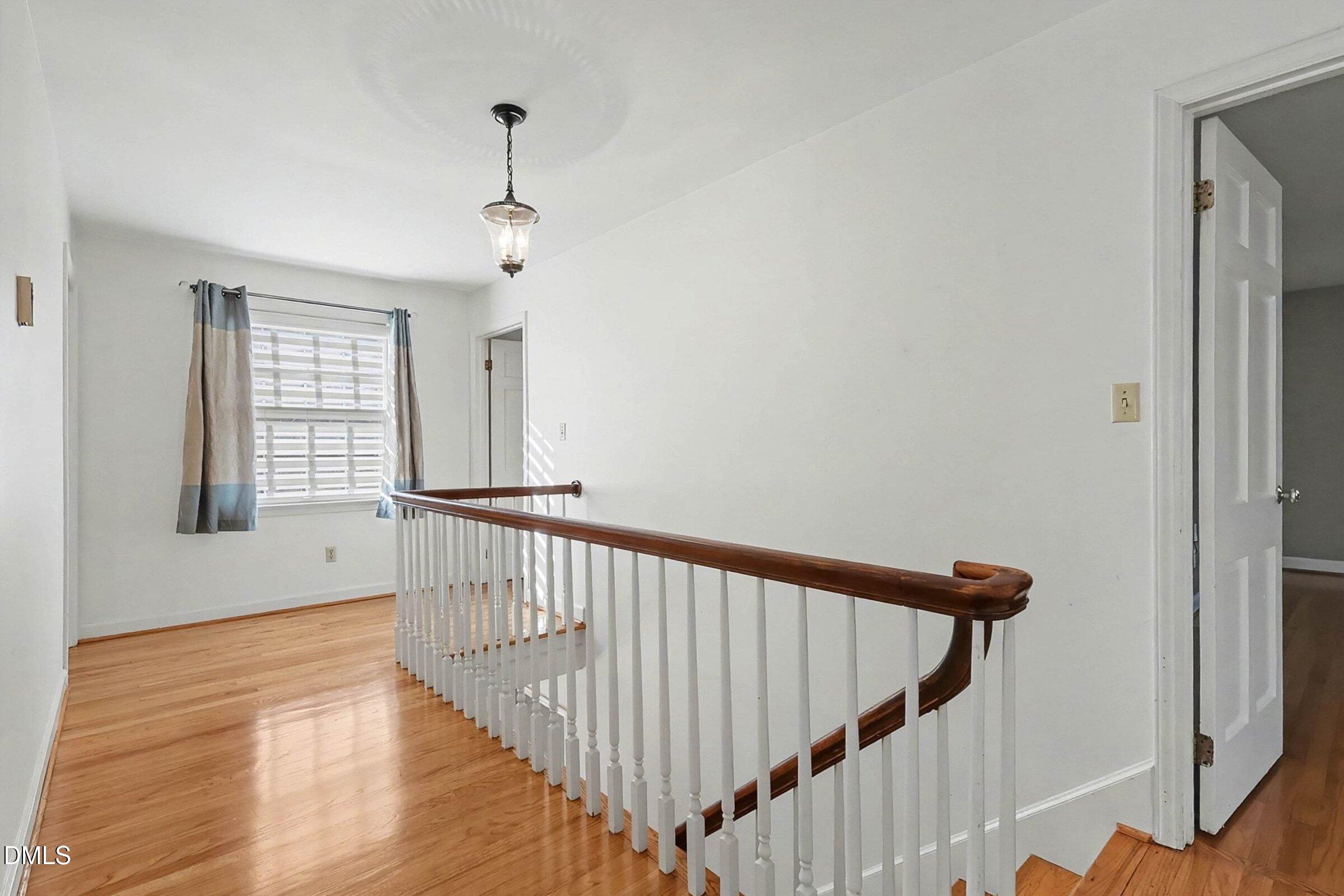 3704 Pembrook Place Raleigh, NC 27612 - Photo 25 of 68 a view of a hallway with windows