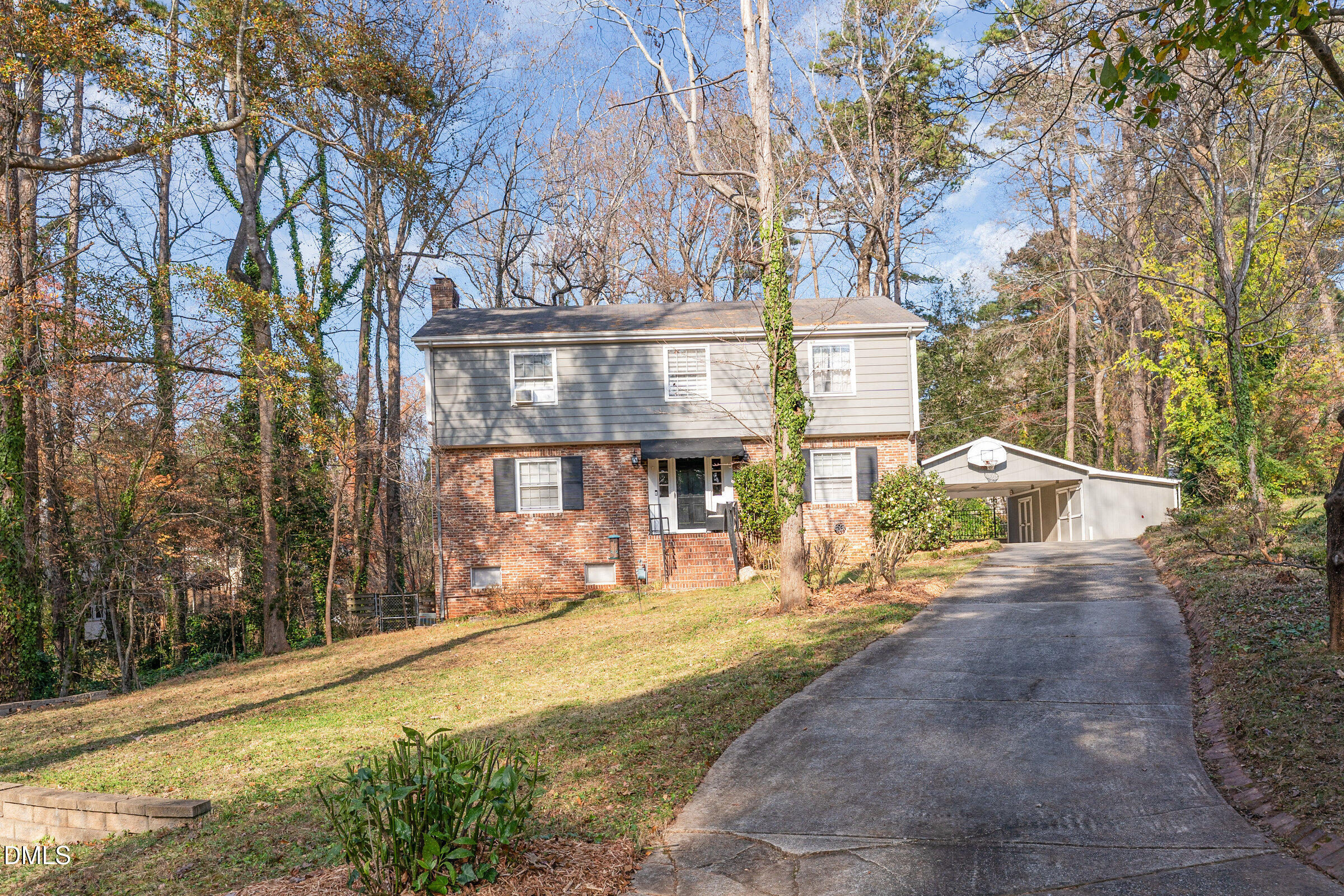 3704 Pembrook Place Raleigh, NC 27612 - Photo 3 of 68 a front view of a house with a yard and trees