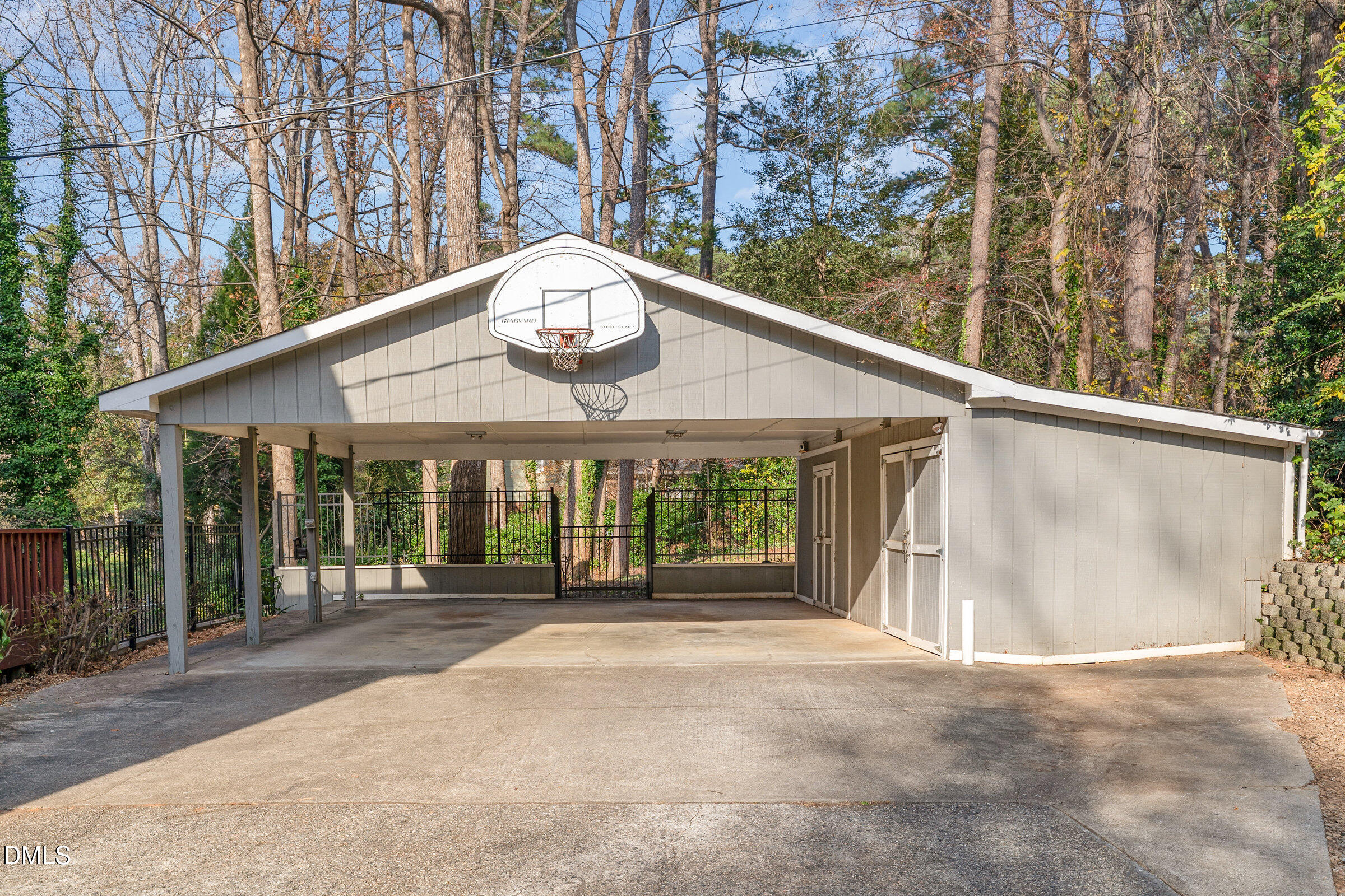 3704 Pembrook Place Raleigh, NC 27612 - Photo 64 of 68 a front view of a house with a garden and trees